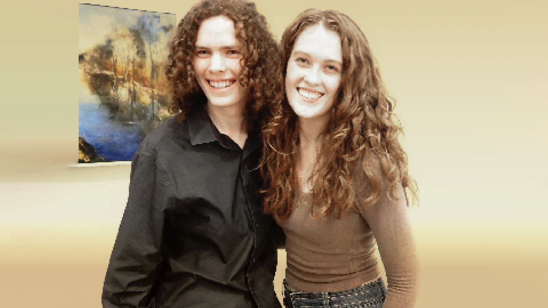 a young man and young woman, both curly-haired red-heads, who are musicians